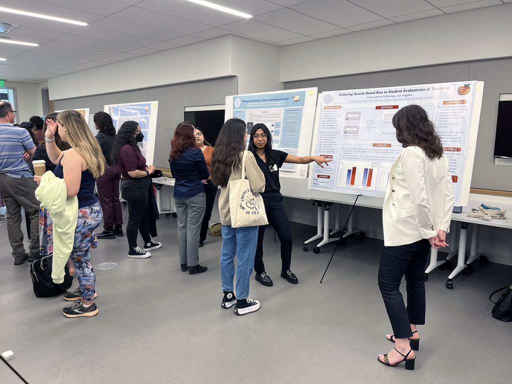 Student presenting their poster at poster session